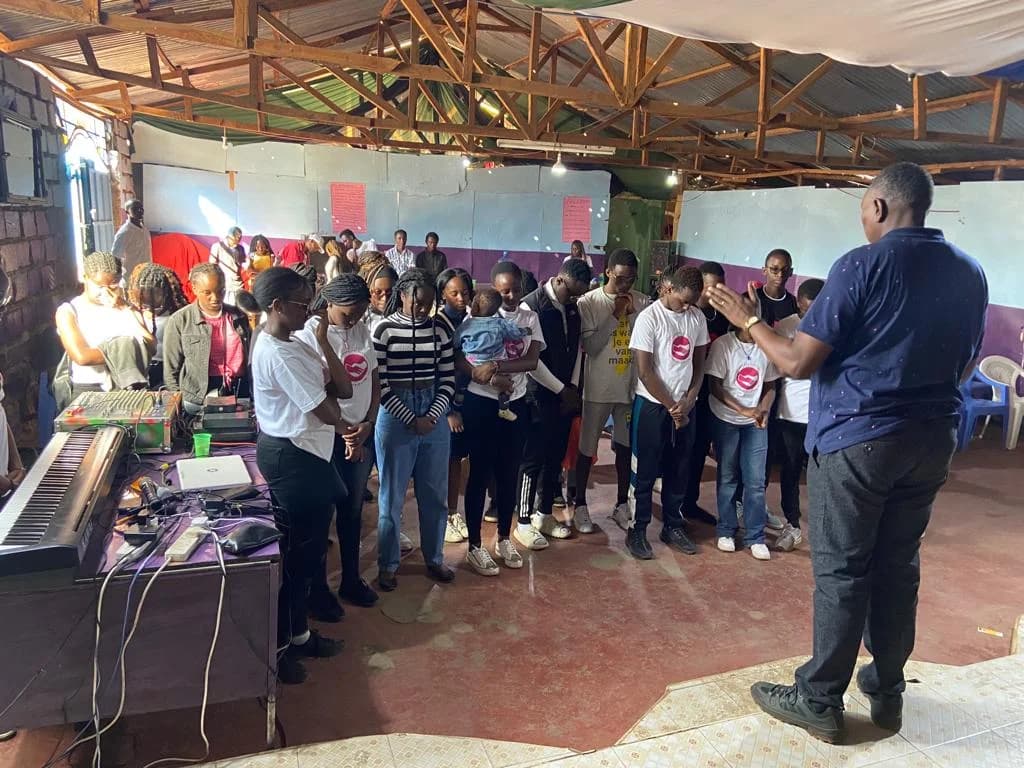 Furaha members gathered together inside the community venue at Zion